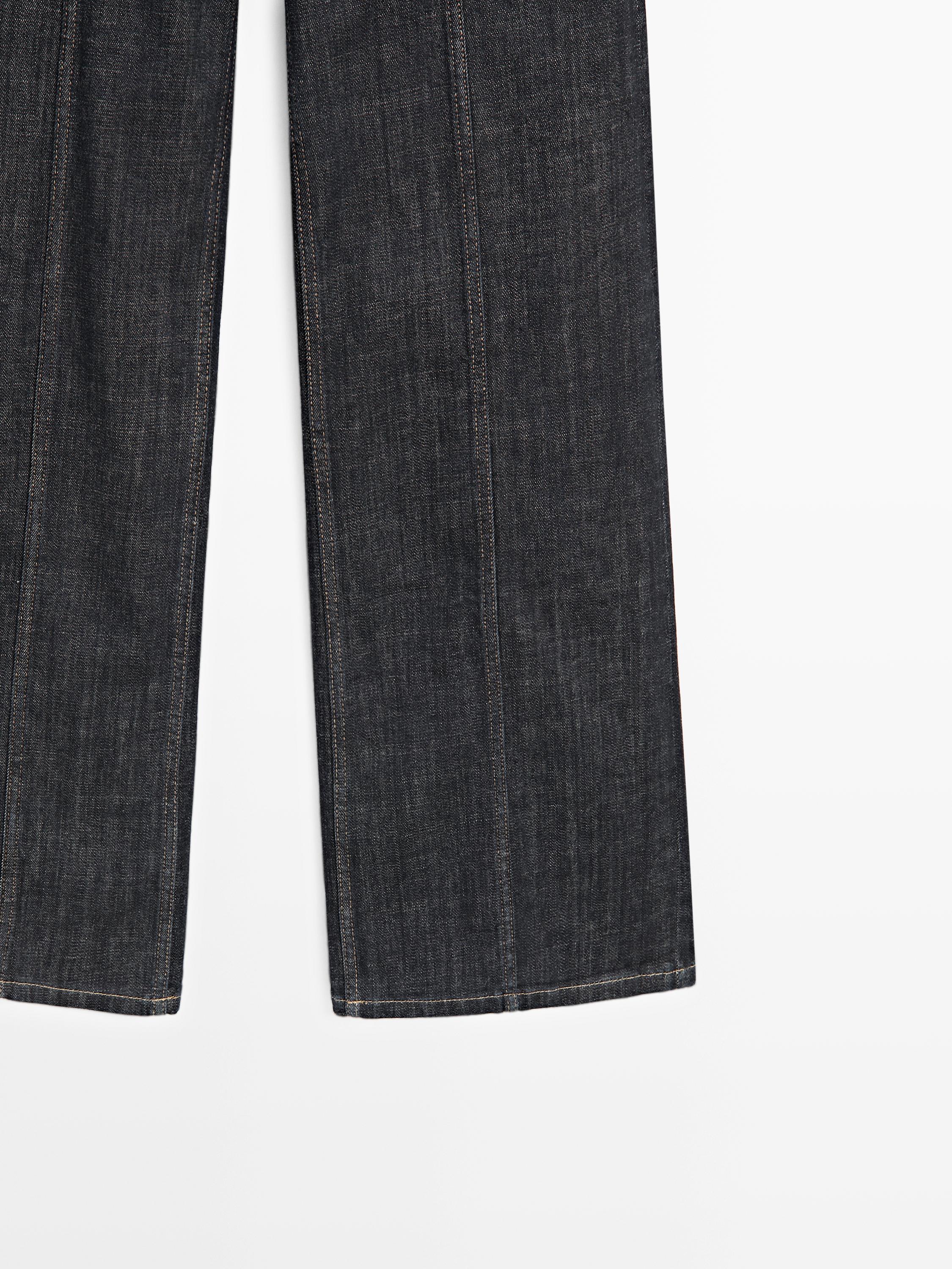 High-waist wide-leg jeans with chains